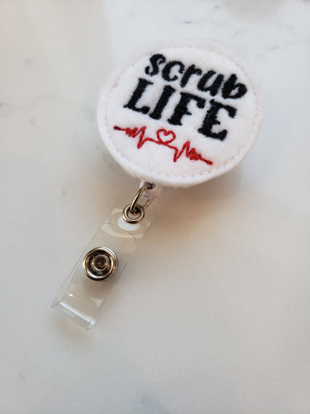 White scrub life badge reel with heart beat