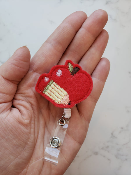 red embroidered apple teacher badge reel